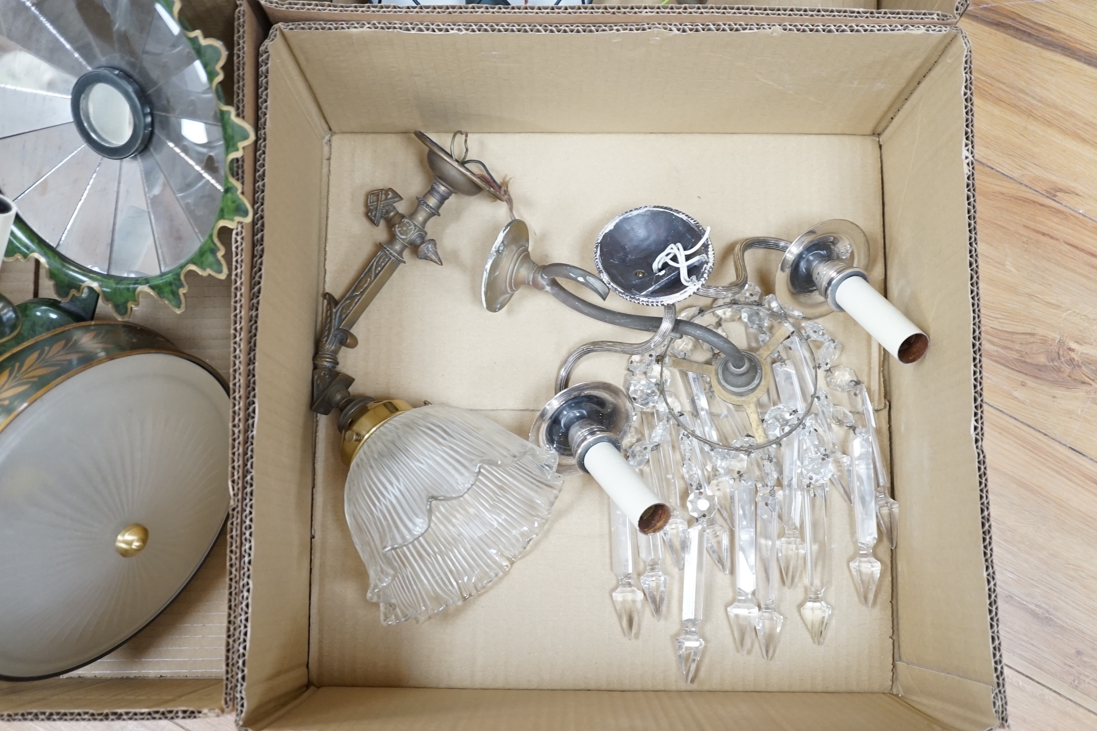 Twelve various lights: a lustre wall light, two branch chrome wall light, and glass shaded wall light, two pairs of toleware style wall lights and a similar ceiling and pair of plaster wall lights (12). Condition - fair